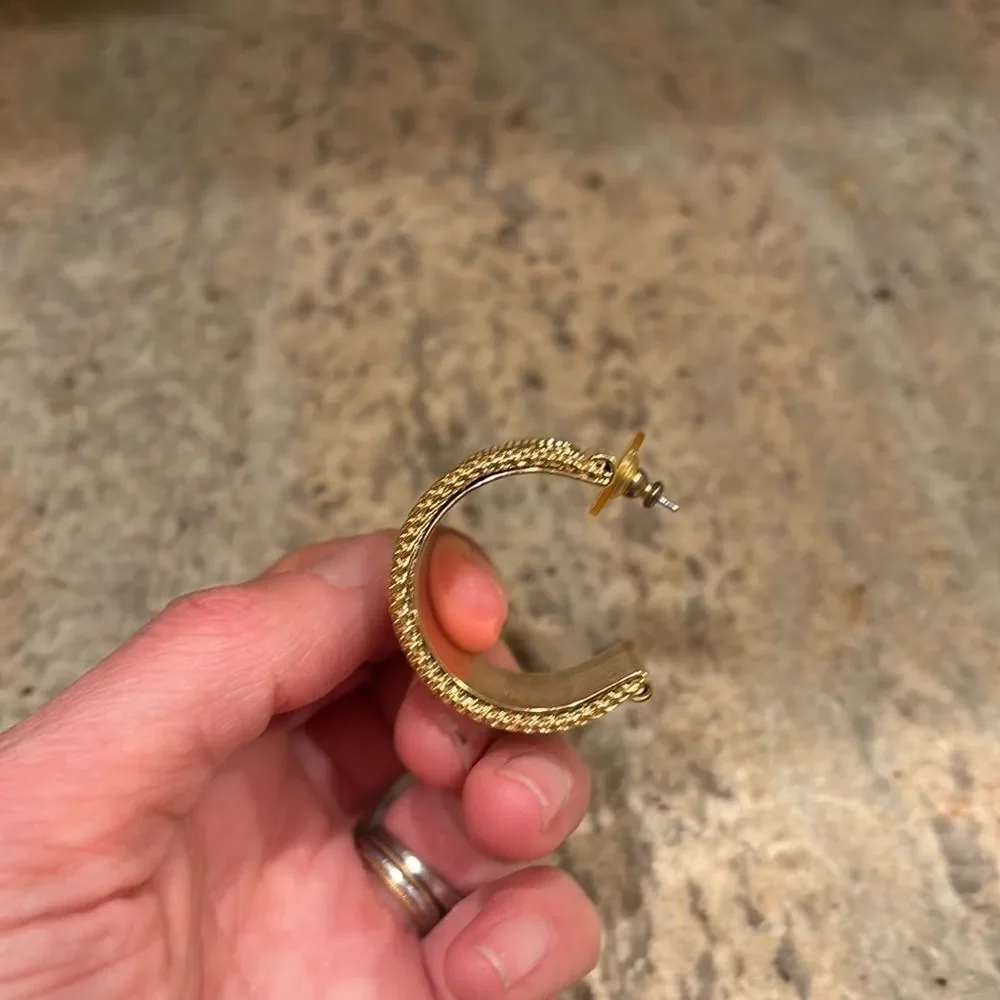 Woman's gold cuff earring. Just one earring